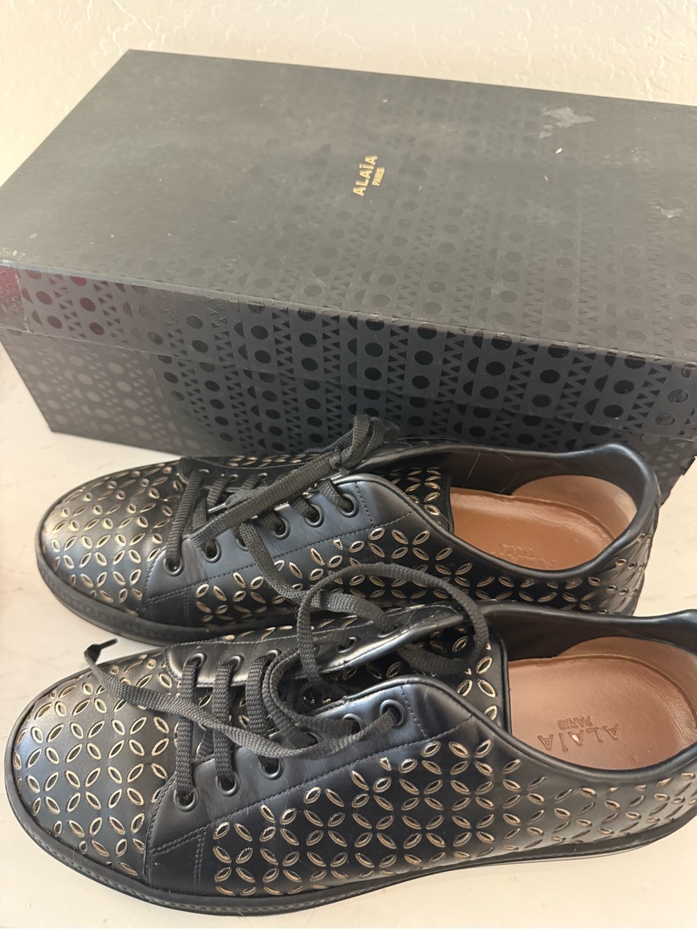 Alaia Black Leather Sneakers with Gold Cutout Pattern - Picture 3 of 3